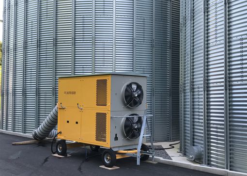 Grain cooling for preventing pests in feed